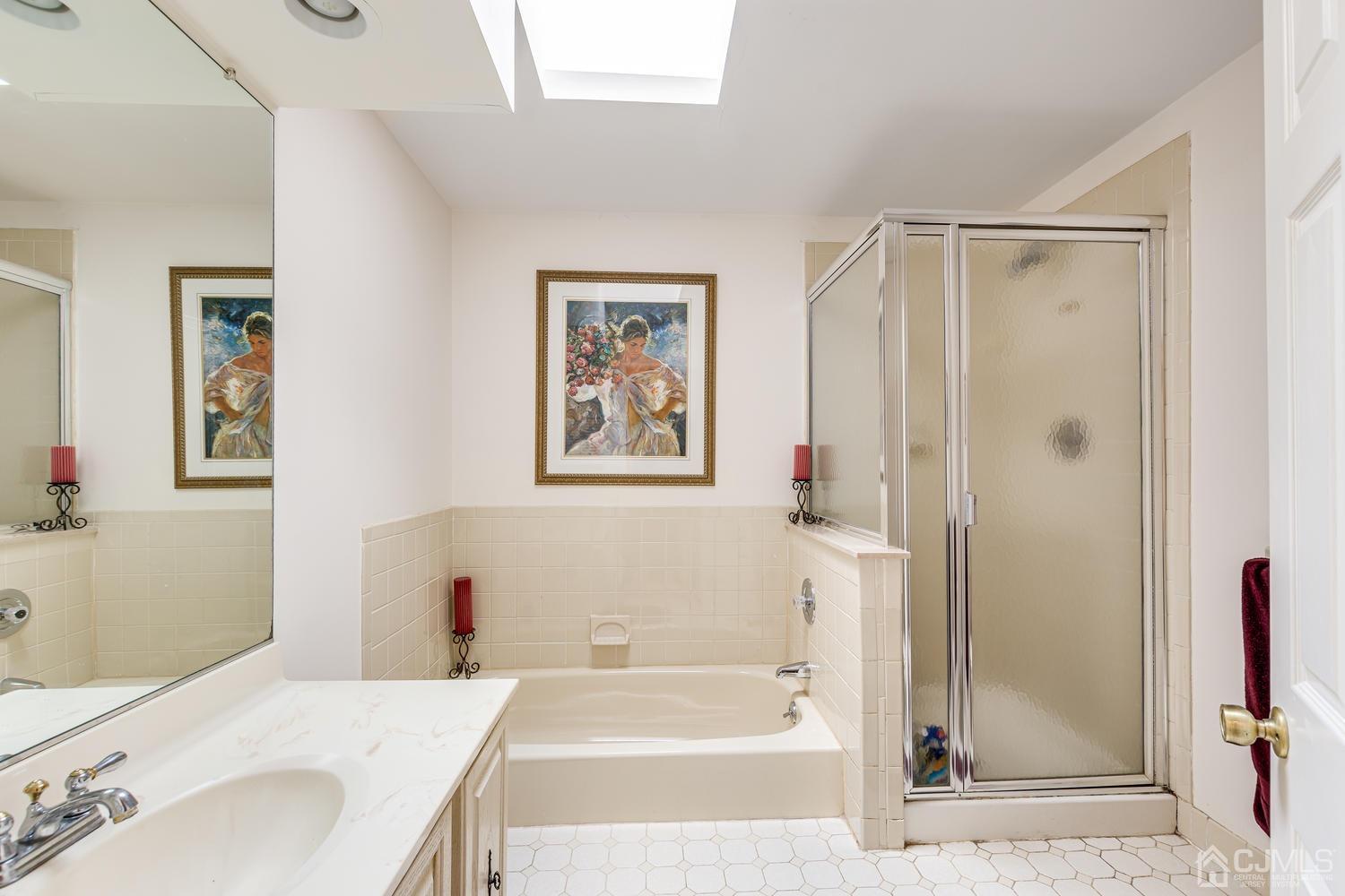 4303 Springbrook Drive Edison, NJ 08820 - Photo 27 of 40 a bathroom with a bathtub and a sink