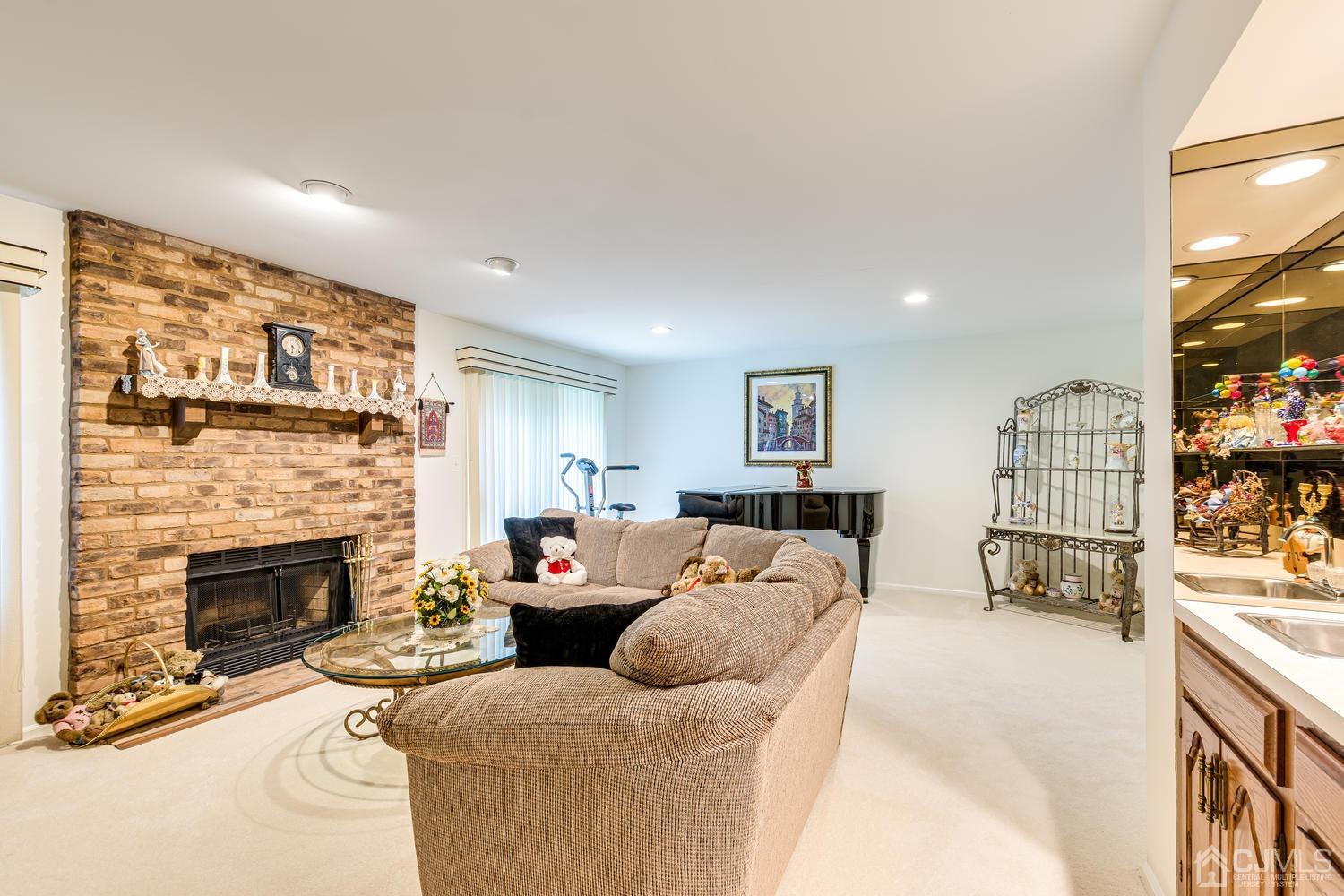 4303 Springbrook Drive Edison, NJ 08820 - Photo 36 of 40 a living room with furniture and a fireplace