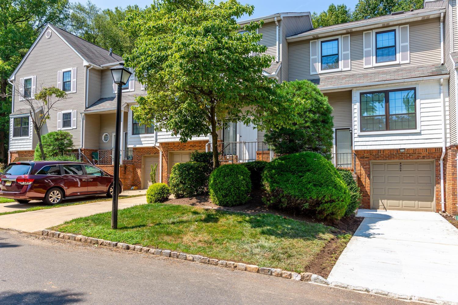 4303 Springbrook Drive Edison, NJ 08820 - Photo 5 of 40 a view of house with a yard and parking space
