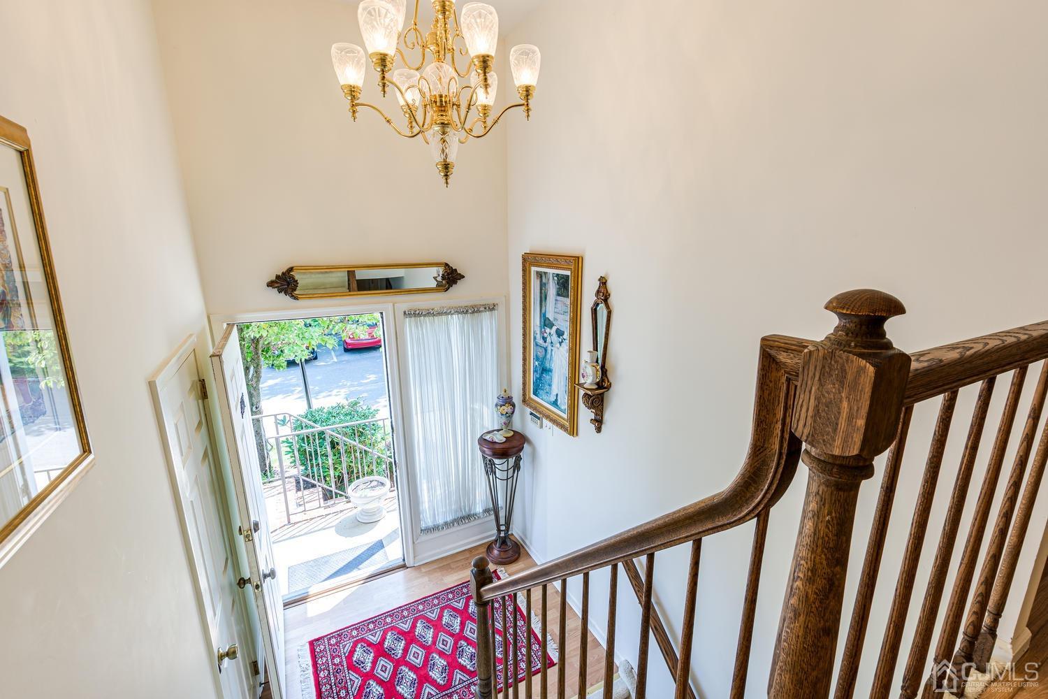 4303 Springbrook Drive Edison, NJ 08820 - Photo 10 of 40 a view of a hallway with furniture and chandelier