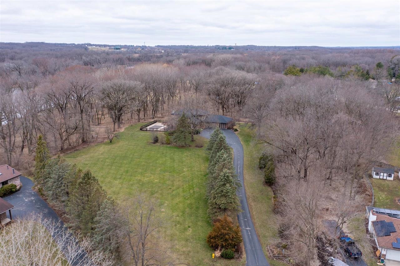 11640 Bend River Road Roscoe, IL 61073 - Photo 6 of 9 an aerial view of a forest with lots of trees