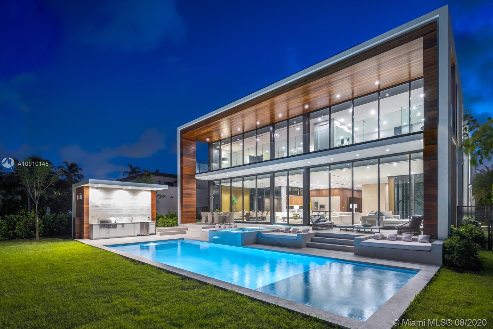 6493 Allison Road Miami Beach, FL 33141 - Photo 1 of 41 a view of swimming pool with outdoor seating and house in the background
