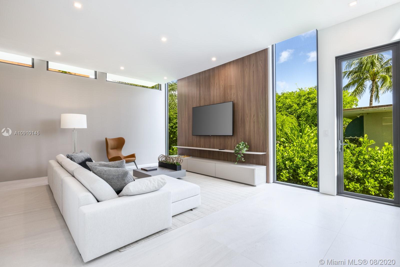 6493 Allison Road Miami Beach, FL 33141 - Photo 12 of 41 a living room with furniture and a flat screen tv
