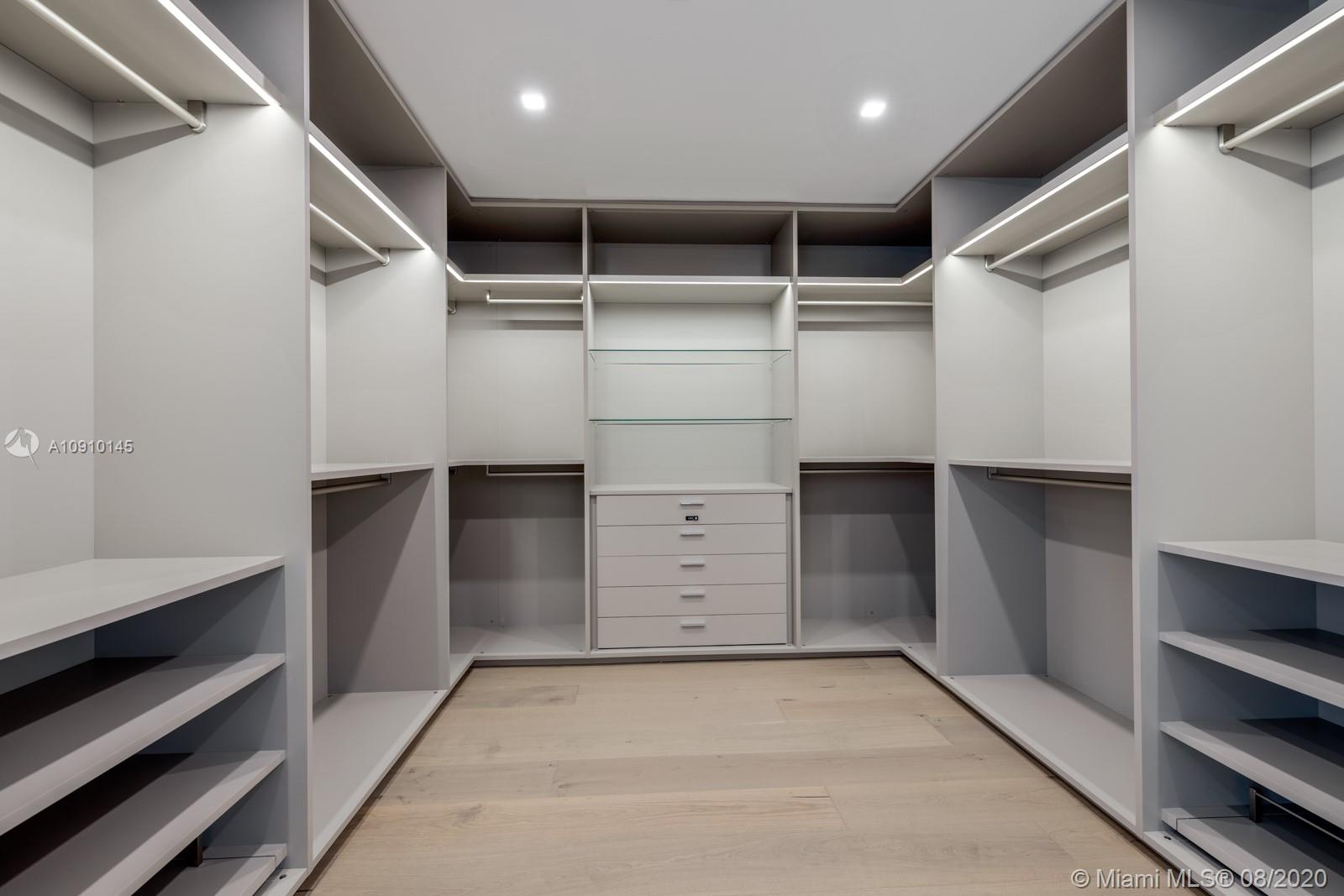 6493 Allison Road Miami Beach, FL 33141 - Photo 21 of 41 a view of an empty walk in closet