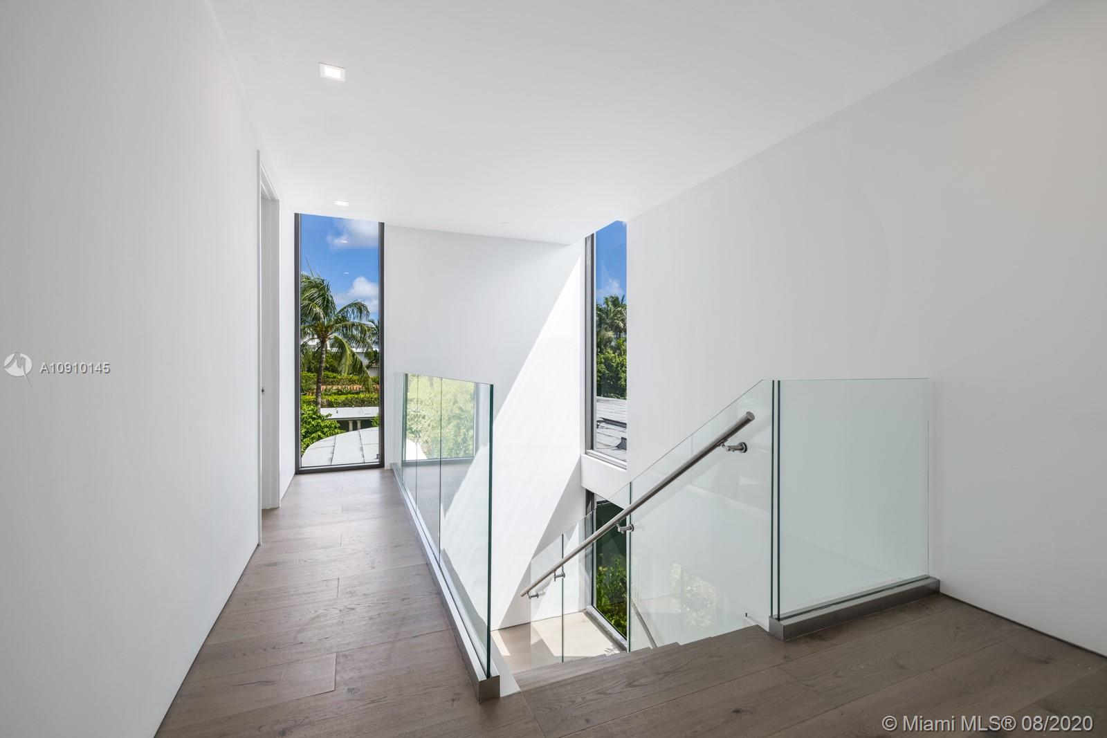 6493 Allison Road Miami Beach, FL 33141 - Photo 23 of 41 a view of a hallway with staircase