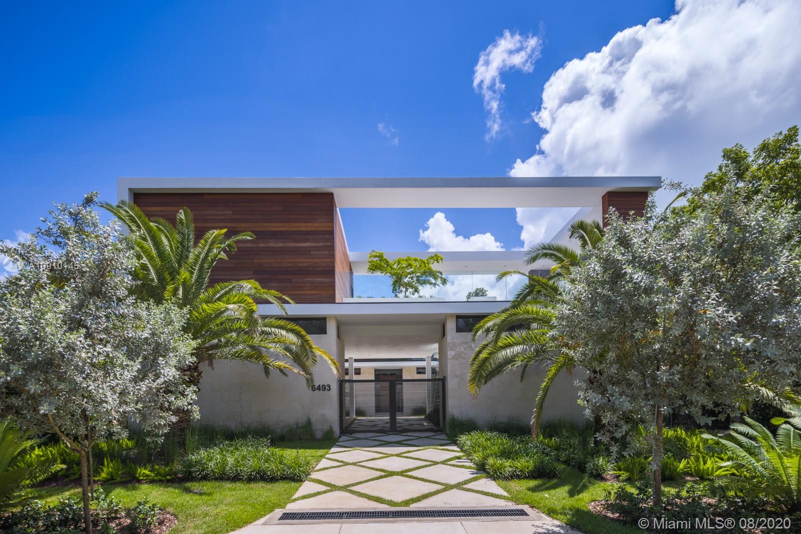 6493 Allison Road Miami Beach, FL 33141 - Photo 31 of 41 a view of a house with a yard and potted plants