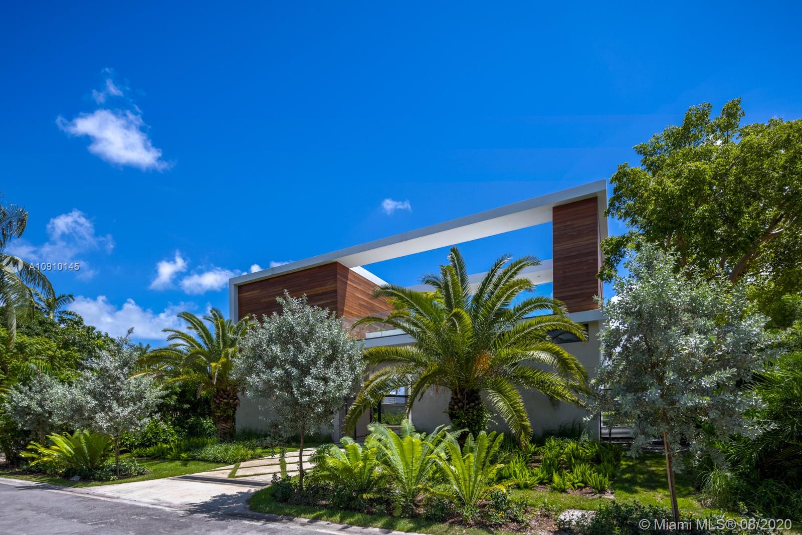 6493 Allison Road Miami Beach, FL 33141 - Photo 32 of 41 a view of a house with a yard and potted plants