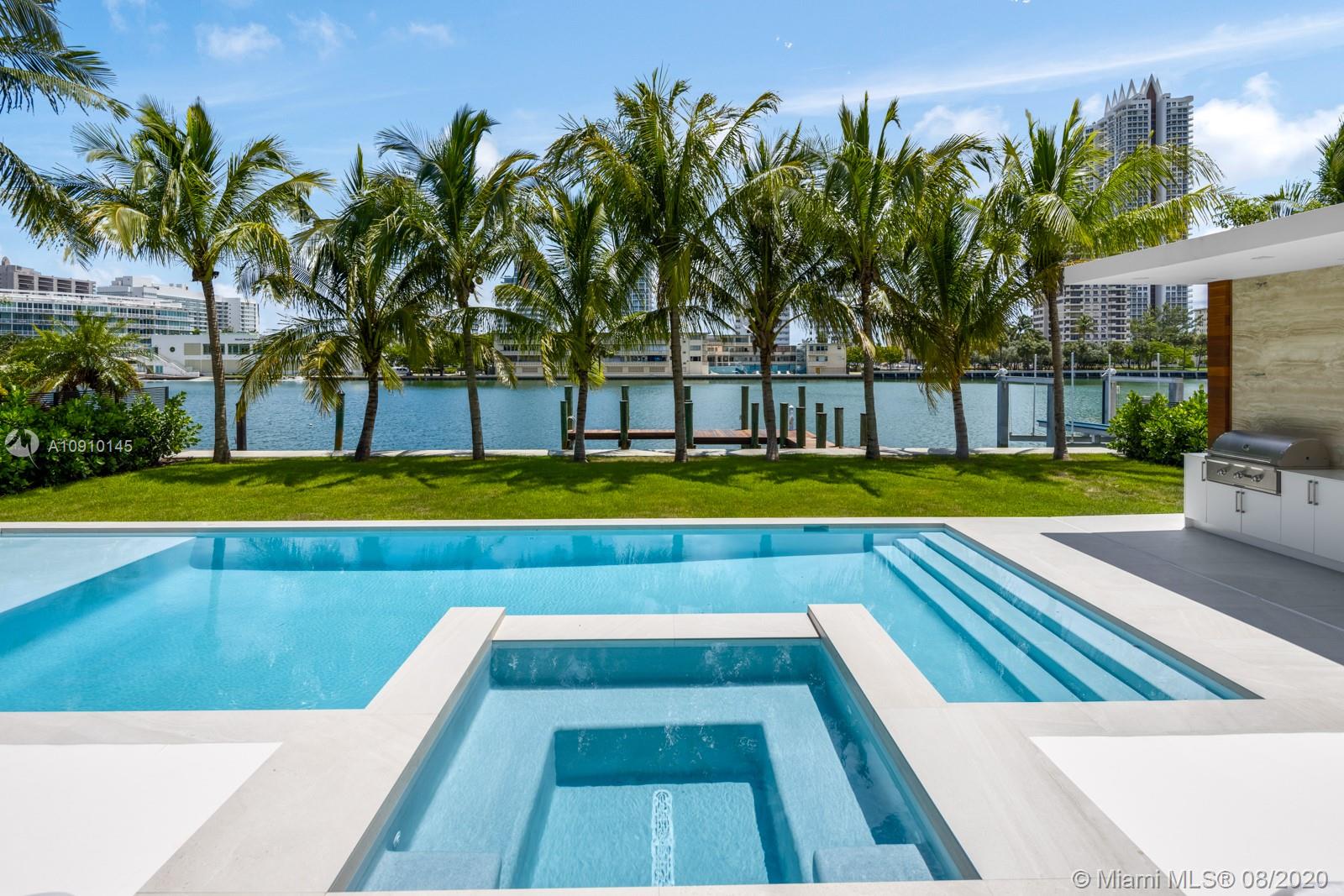 6493 Allison Road Miami Beach, FL 33141 - Photo 33 of 41 a view of swimming pool with palm trees
