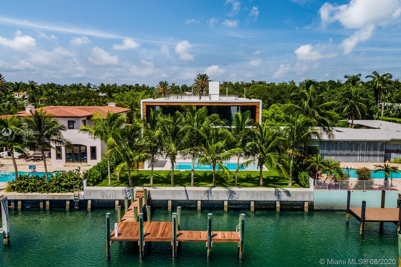 6493 Allison Road Miami Beach, FL 33141 - Photo 37 of 41 a view of a chair and table in the patio next to a yard