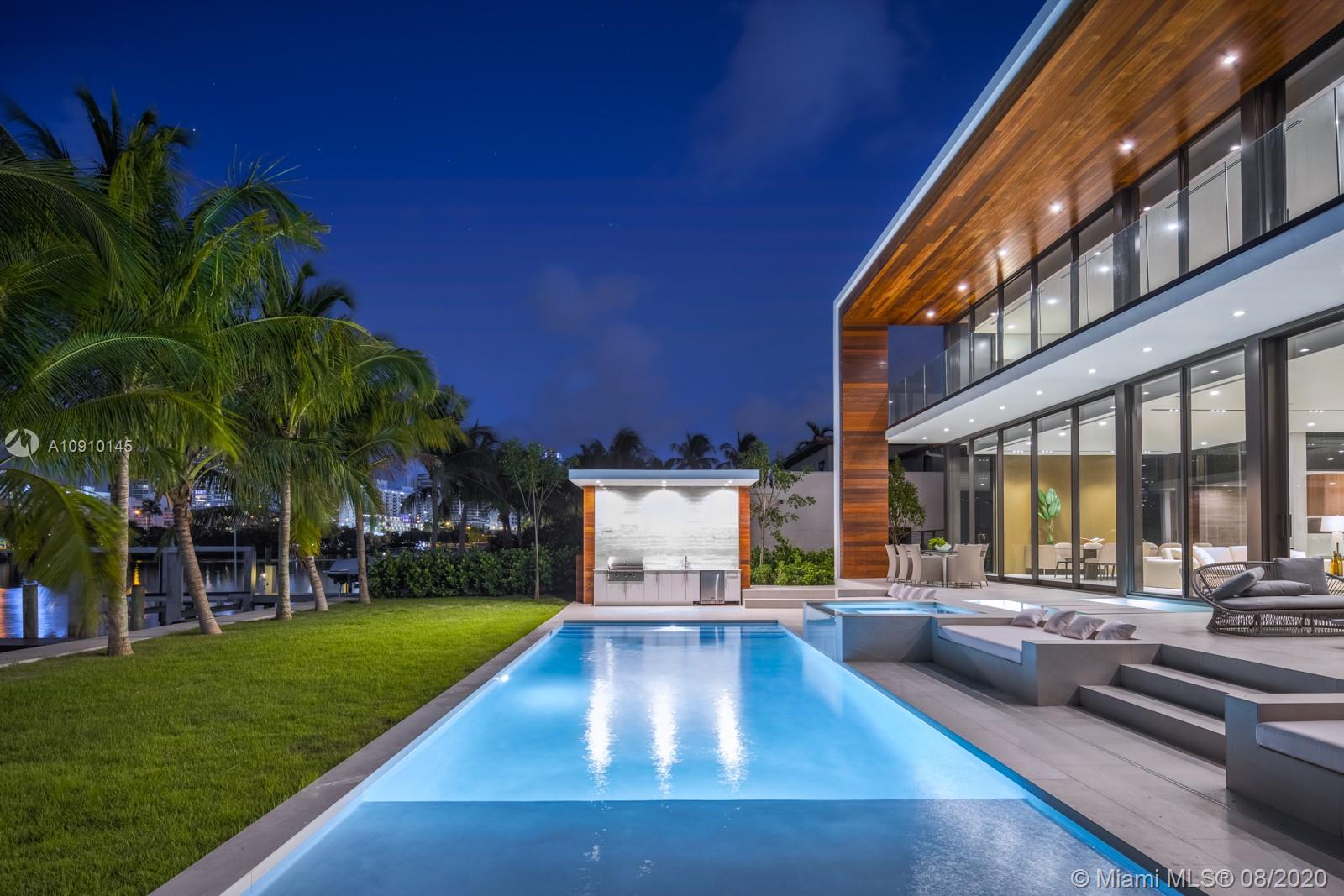 6493 Allison Road Miami Beach, FL 33141 - Photo 5 of 41 a view of a house with swimming pool and sitting area