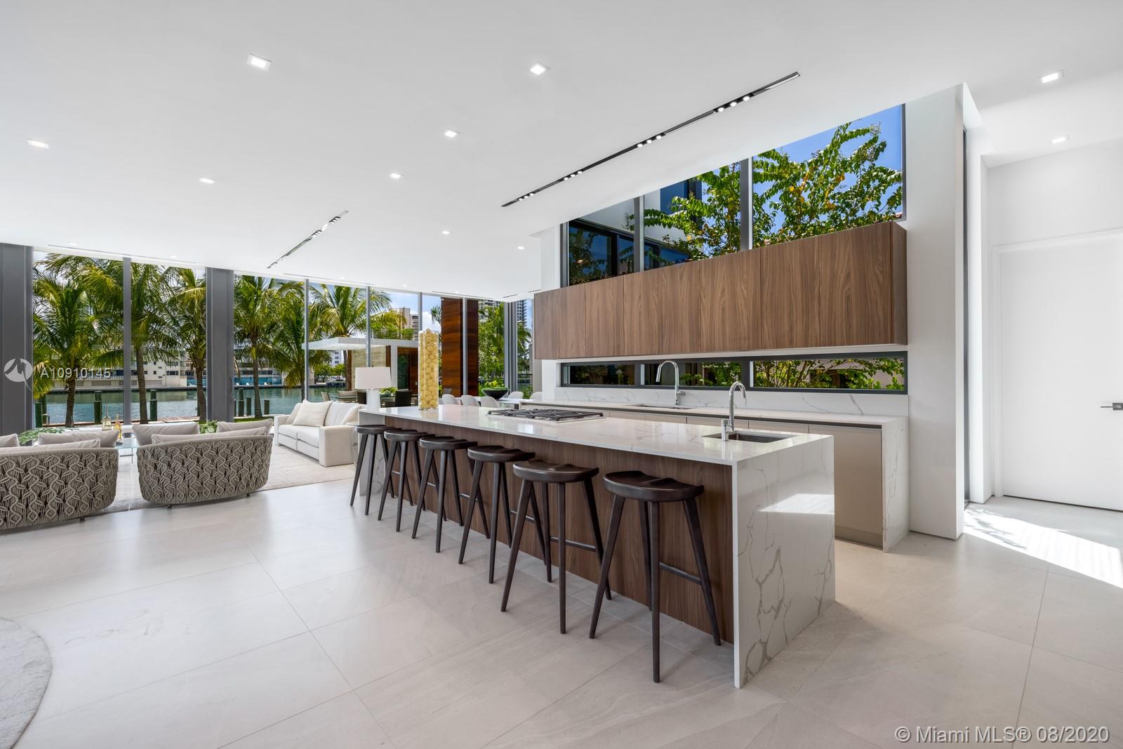 6493 Allison Road Miami Beach, FL 33141 - Photo 7 of 41 a kitchen with a table and chairs