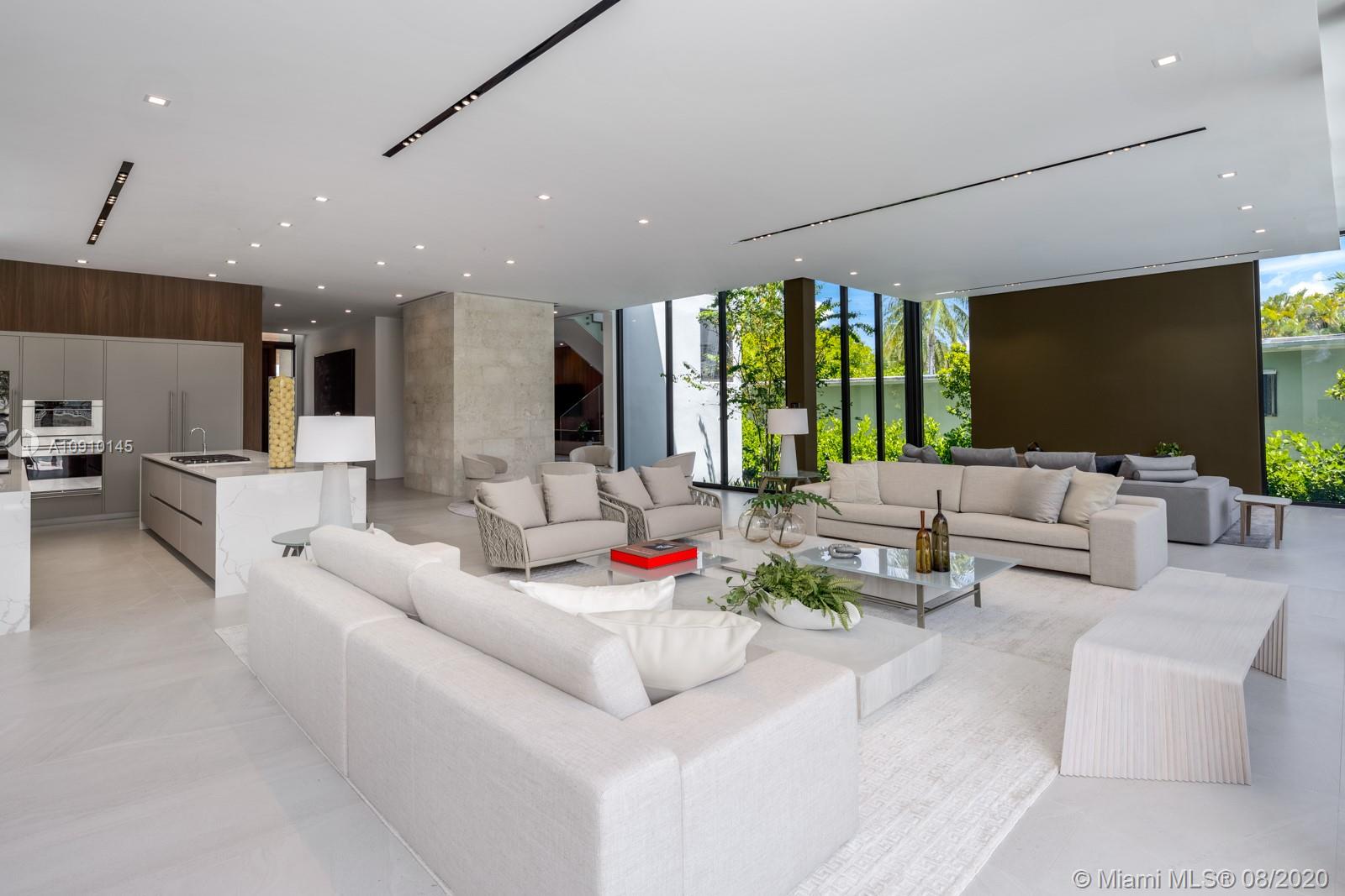 6493 Allison Road Miami Beach, FL 33141 - Photo 10 of 41 a living room with furniture and a flat screen tv
