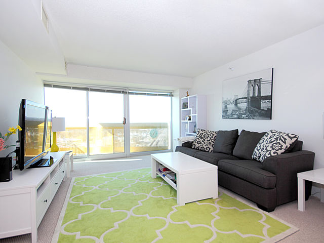 1720 Maple Avenue, Unit 1880 Evanston, IL 60201 - Photo 3 of 15 a living room with furniture and a large window