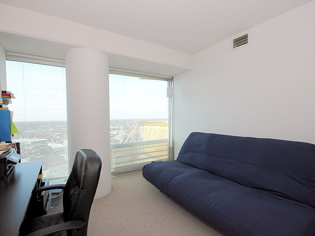 1720 Maple Avenue, Unit 1880 Evanston, IL 60201 - Photo 7 of 15 a living room with furniture and a large window