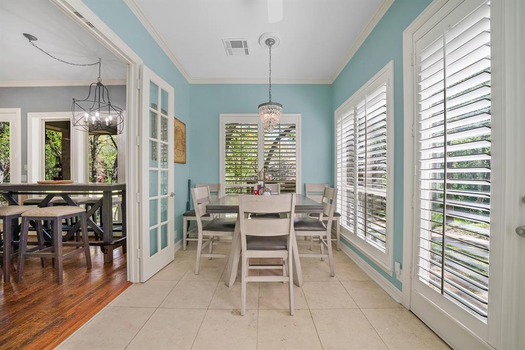 621 Diamond Point Drive Oak Point, TX 75068 - Photo 15 of 40 a dining room with furniture window wooden floor and a chandelier