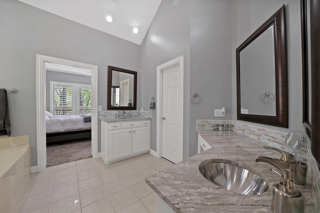 621 Diamond Point Drive Oak Point, TX 75068 - Photo 19 of 40 a bathroom with a granite countertop sink and a mirror