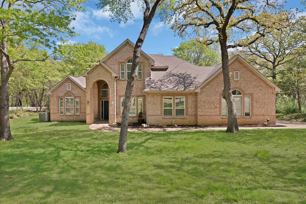 621 Diamond Point Drive Oak Point, TX 75068 - Photo 2 of 40 a front view of a house with a yard
