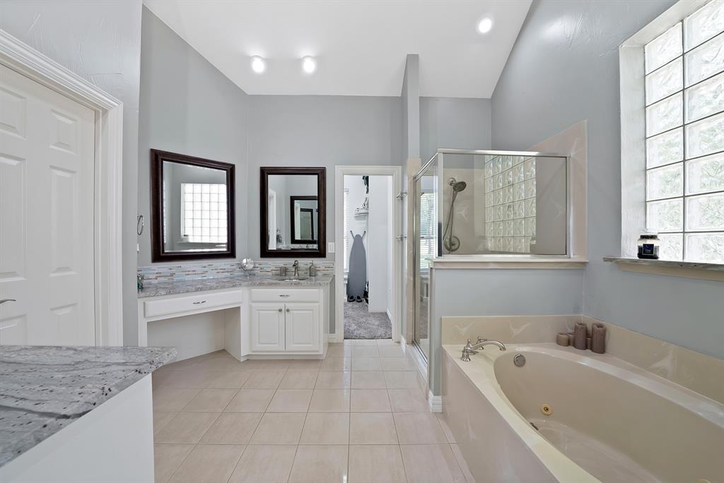 621 Diamond Point Drive Oak Point, TX 75068 - Photo 21 of 40 a bathroom with a granite countertop tub sink shower and mirror