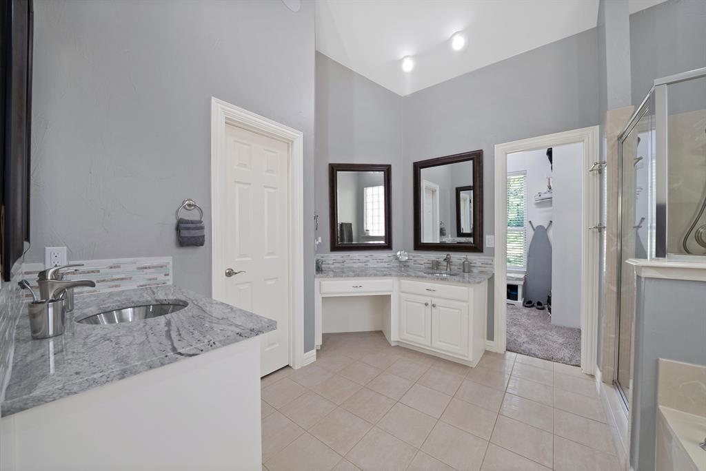 621 Diamond Point Drive Oak Point, TX 75068 - Photo 22 of 40 a bathroom with a granite countertop sink and a mirror