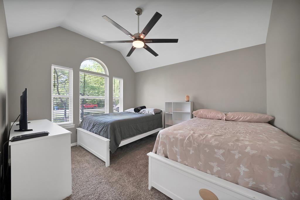 621 Diamond Point Drive Oak Point, TX 75068 - Photo 26 of 40 a bedroom with two beds and a large window