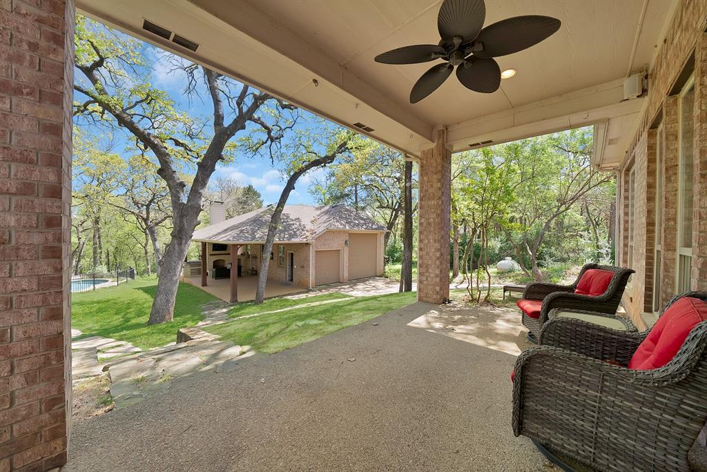 621 Diamond Point Drive Oak Point, TX 75068 - Photo 31 of 40 a living room with furniture and a floor to ceiling window