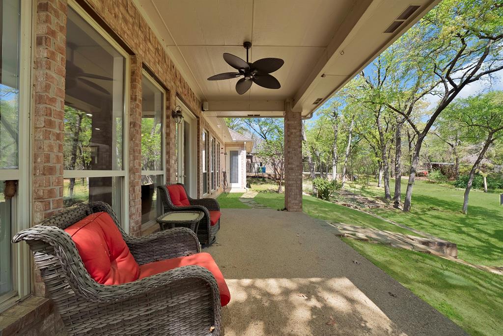 621 Diamond Point Drive Oak Point, TX 75068 - Photo 32 of 40 a view of a porch with furniture and a backyard