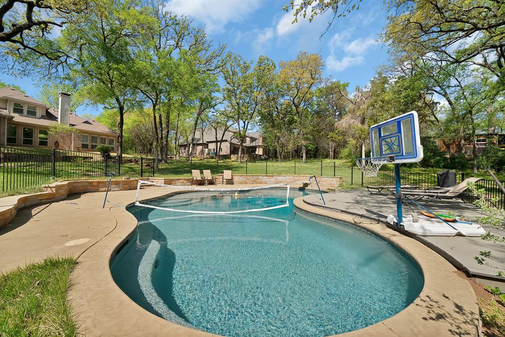 621 Diamond Point Drive Oak Point, TX 75068 - Photo 38 of 40 a view of a swimming pool with a patio