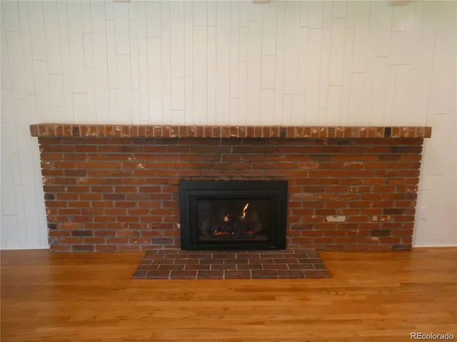 a stone house with a bench