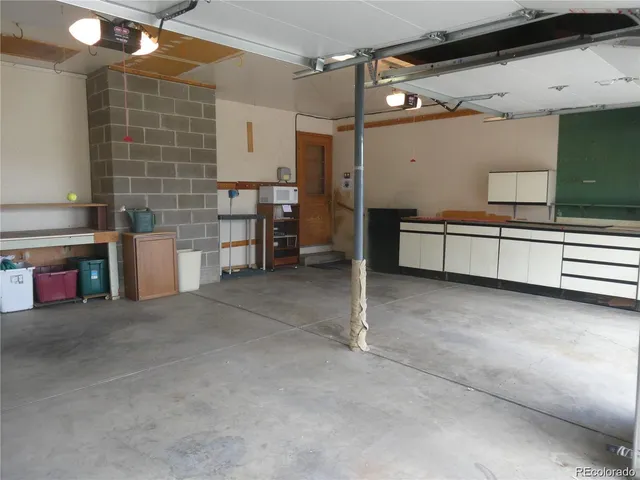 a large white cabinet with a fireplace in it