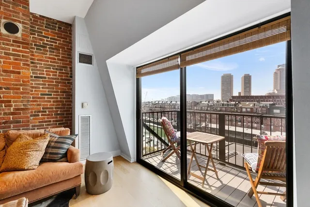 a view of balcony with furniture