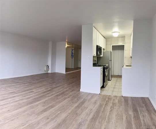 a view of a kitchen with wooden floor