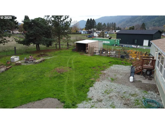 a aerial view of a house with table and chairs