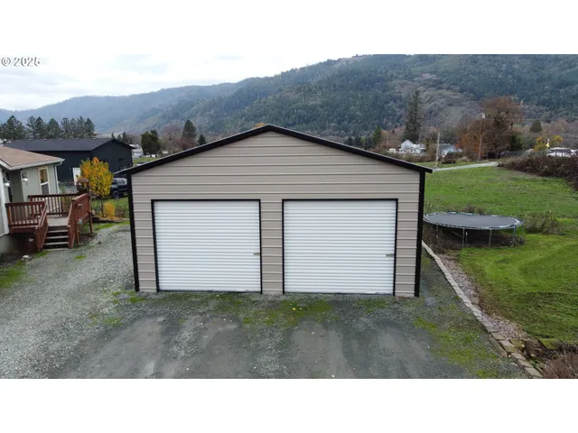 a backyard of a house with lots of green space