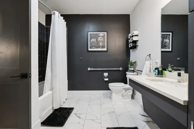a en suite bathroom with a sink and a mirror