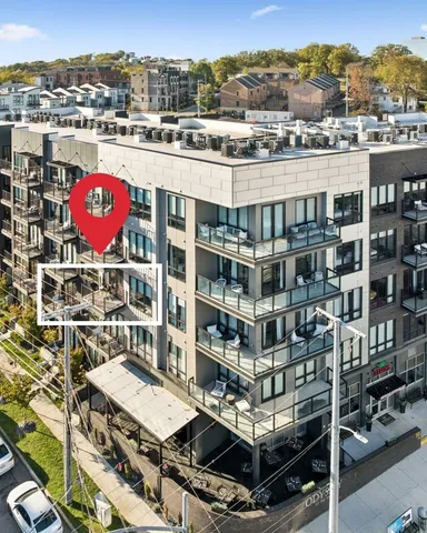 a living room with kitchen island furniture and a wooden floor