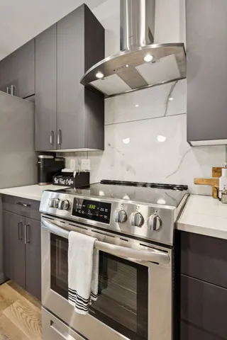 a kitchen with a sink stove and refrigerator