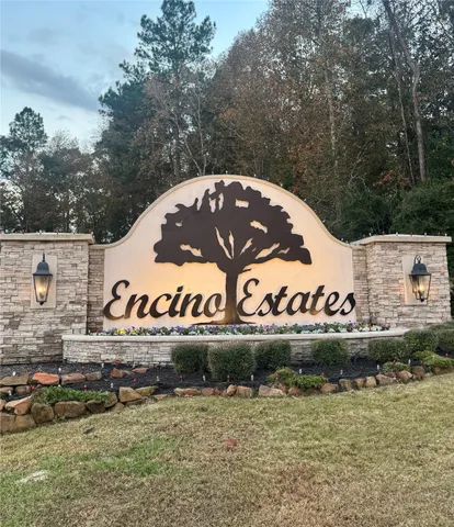 a view of outdoor space with signage and flags