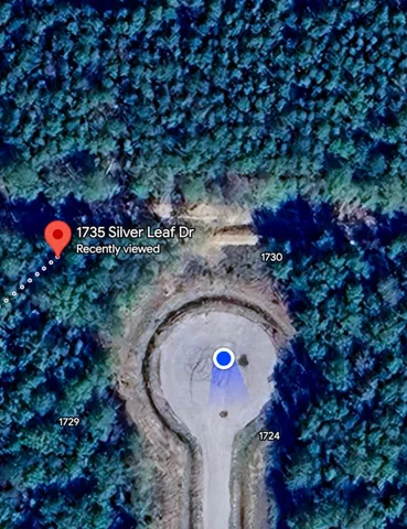 a view of swimming pool with a yard