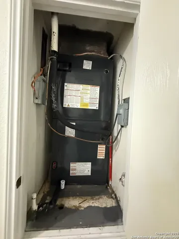 a living room with a toilet and a rug