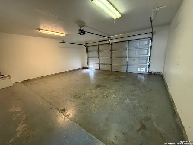 an empty room with a empty space and windows