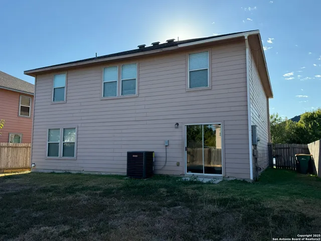 a brick house with a yard