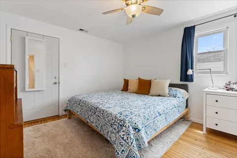 a bedroom with a bed and window