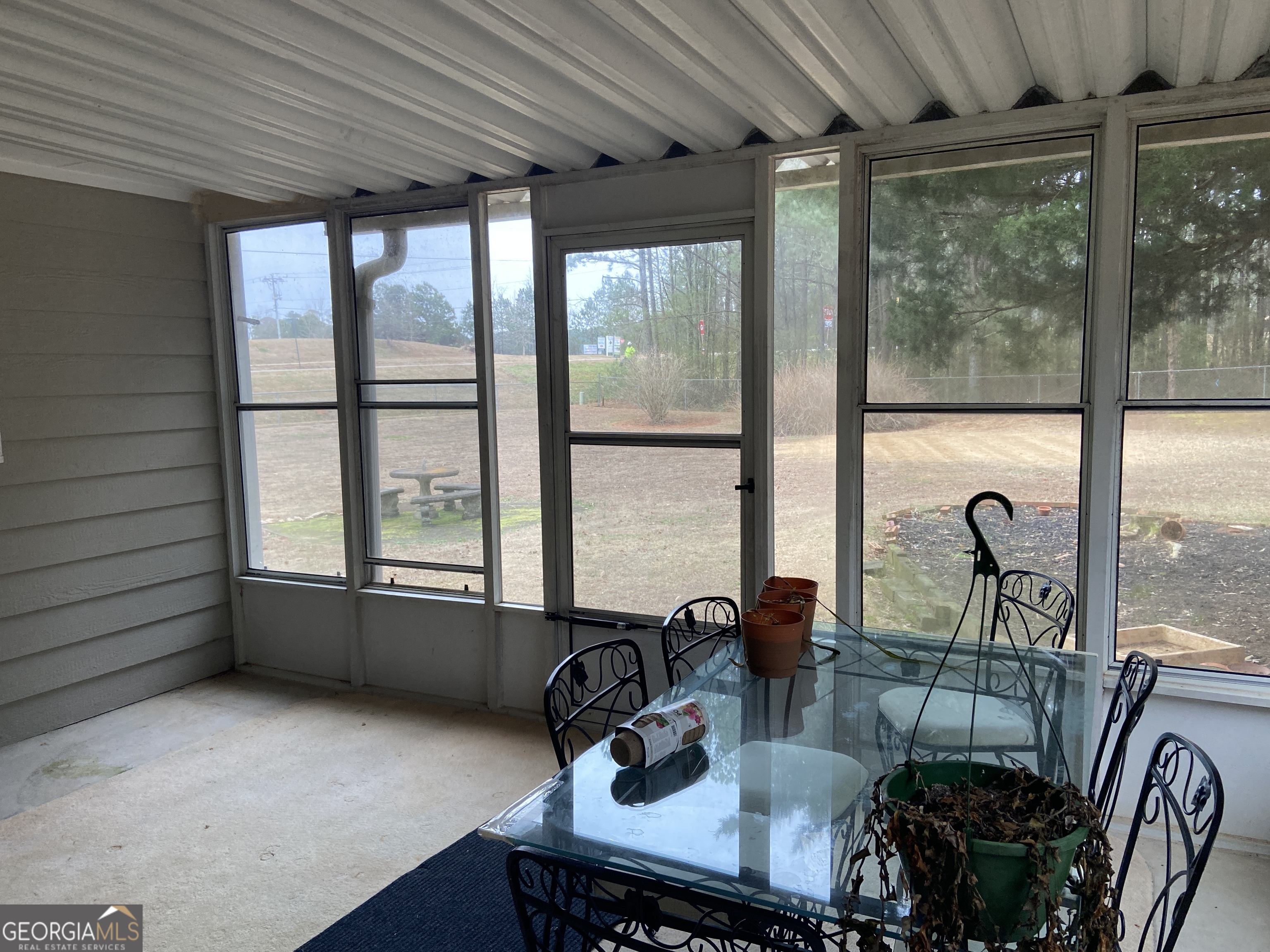 1309 Tom Miller Road Bethlehem, GA 30620 - Photo 20 of 32 a dining room with furniture and floor to ceiling window