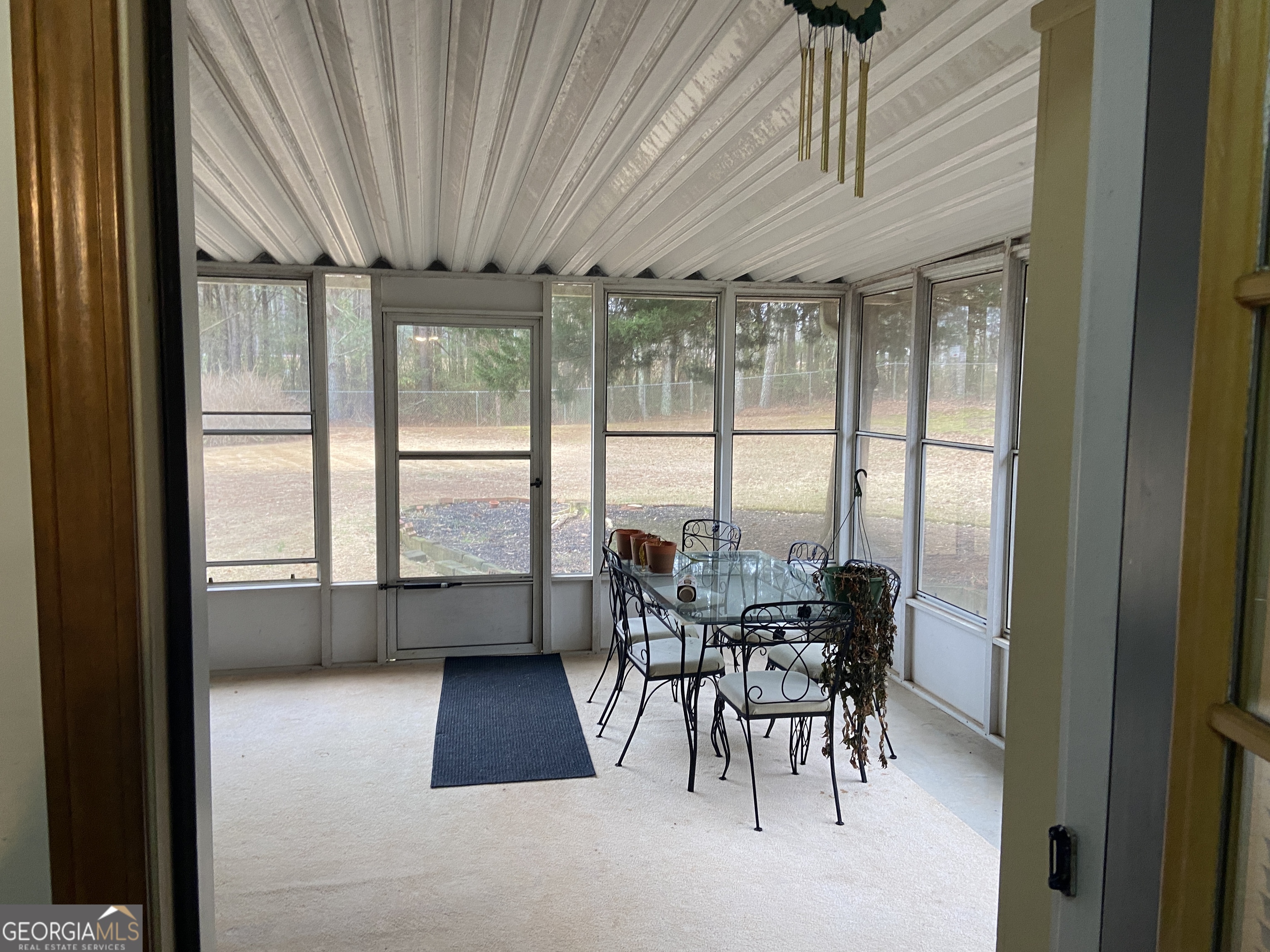 1309 Tom Miller Road Bethlehem, GA 30620 - Photo 21 of 32 a dining room with furniture and a floor to ceiling window