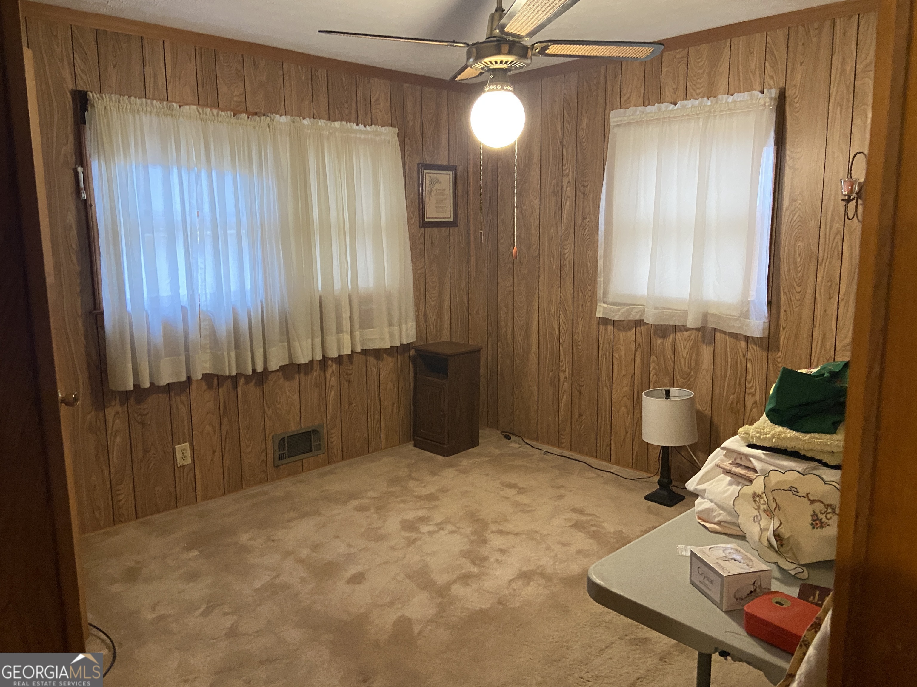 1309 Tom Miller Road Bethlehem, GA 30620 - Photo 26 of 32 a bedroom with a bed and a mirror