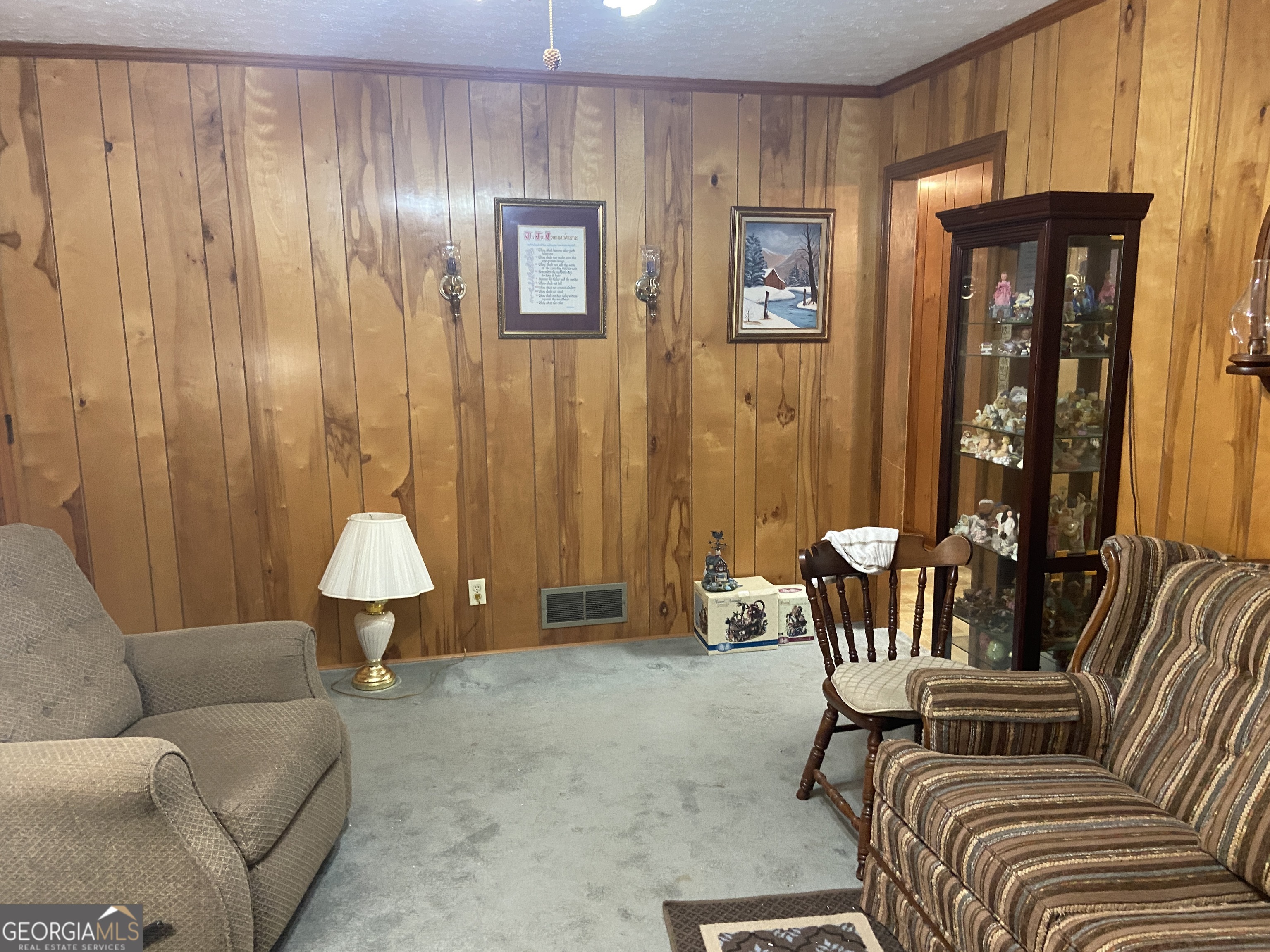 1309 Tom Miller Road Bethlehem, GA 30620 - Photo 29 of 32 a living room with furniture and a lamp