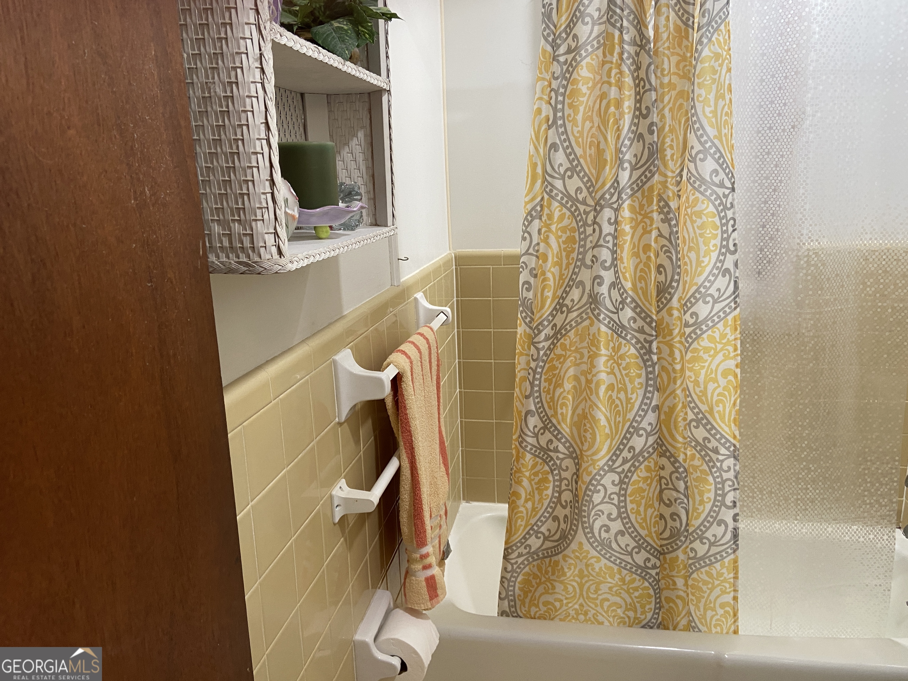 1309 Tom Miller Road Bethlehem, GA 30620 - Photo 30 of 32 a bathroom with a window and a shower
