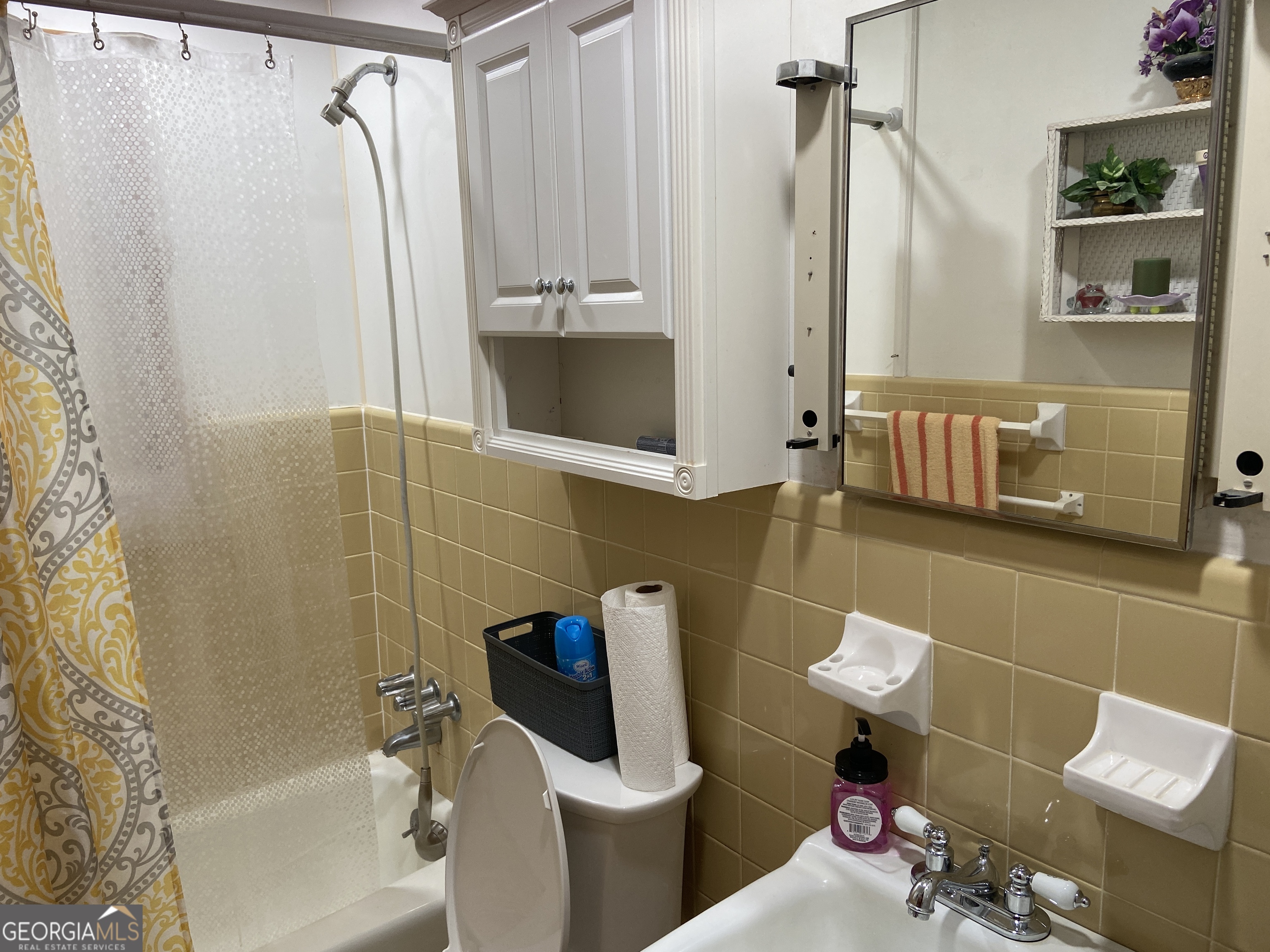 1309 Tom Miller Road Bethlehem, GA 30620 - Photo 31 of 32 a bathroom with a toilet and a shower