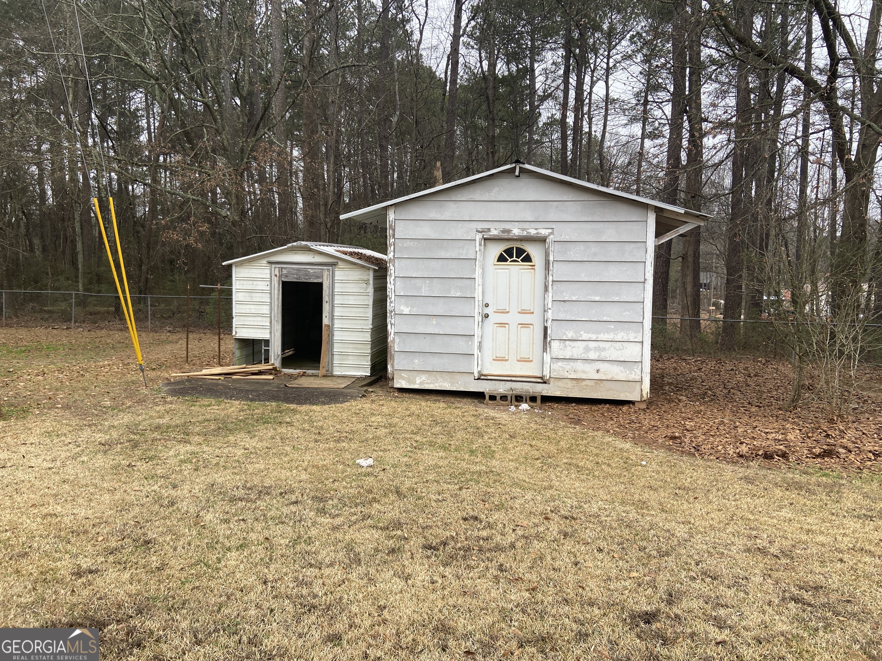 1309 Tom Miller Road Bethlehem, GA 30620 - Photo 5 of 32 a view of a house with a yard