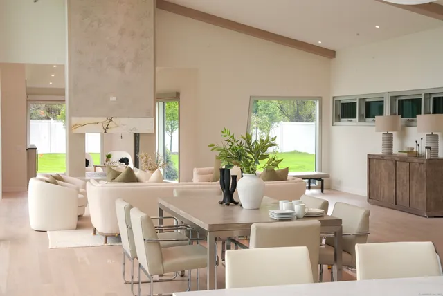 a dining room with furniture and window